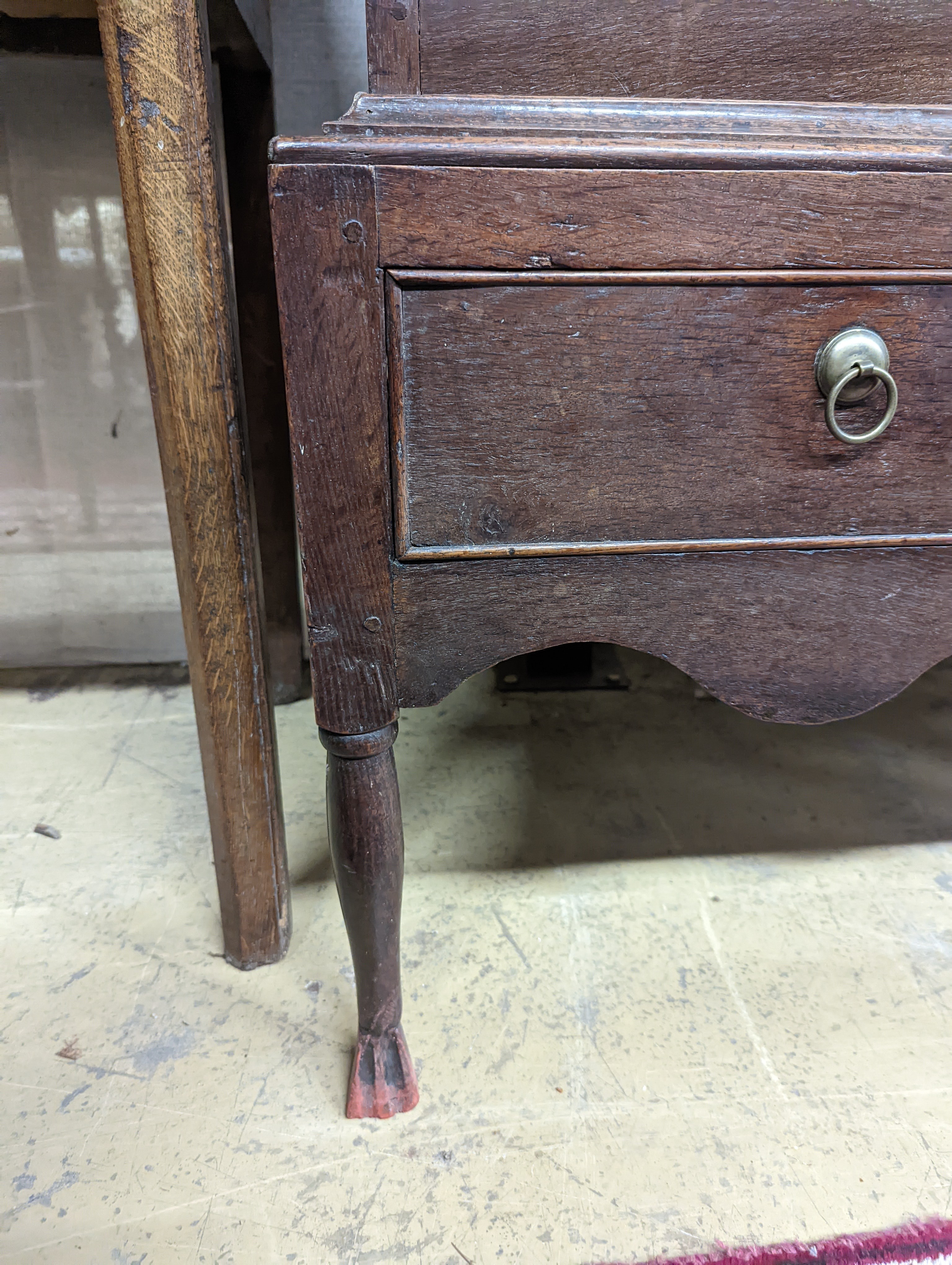 A mid 18th century oak chest on stand, width 89cm, depth 52cm, height 126cm